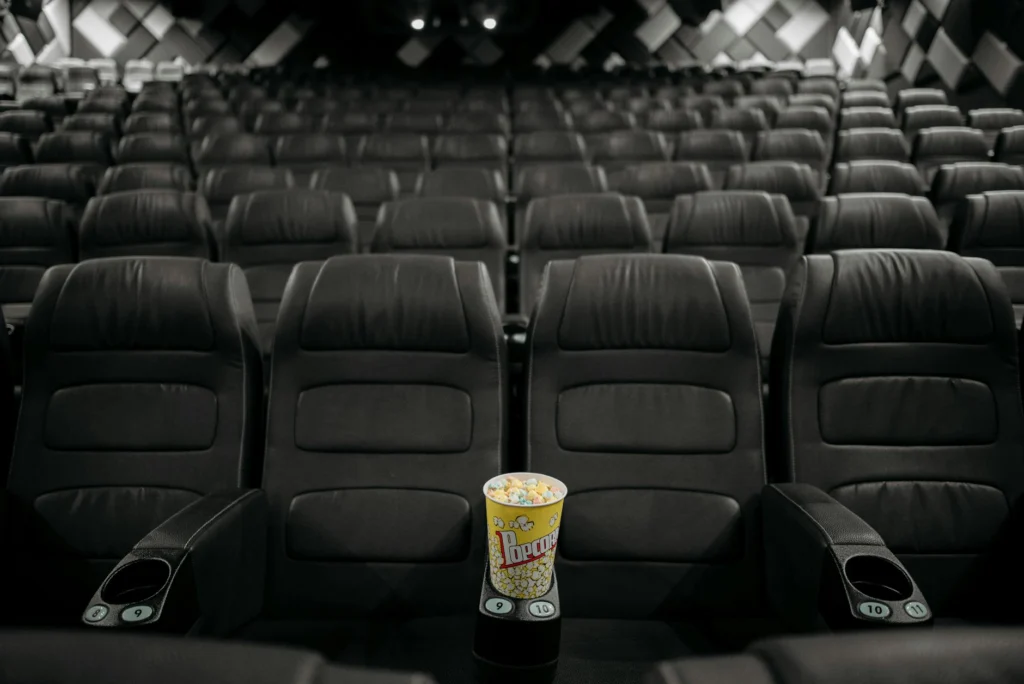 Empty theater seats illustrating prestige film collapse and declining cinema attendance