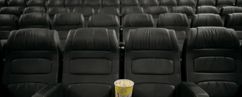 Empty theater seats illustrating prestige film collapse and declining cinema attendance