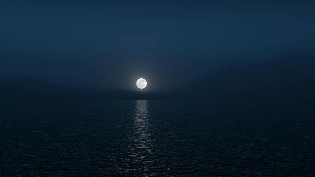 Full moon rising over ocean waves illustrating lunar tidal forces