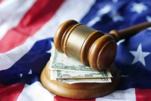 A judge's gavel resting on stacks of cash, illustrating the litigation funding industry