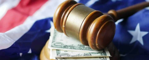 A judge's gavel resting on stacks of cash, illustrating the litigation funding industry