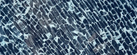 Microscopic view illustrating glass transition physics and amorphous solid structure