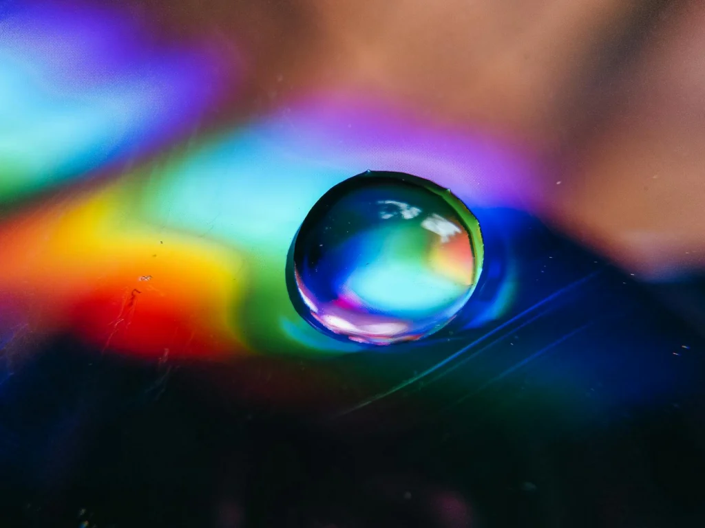Light refracting through water demonstrating rainbow formation physics