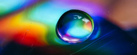 Light refracting through water demonstrating rainbow formation physics