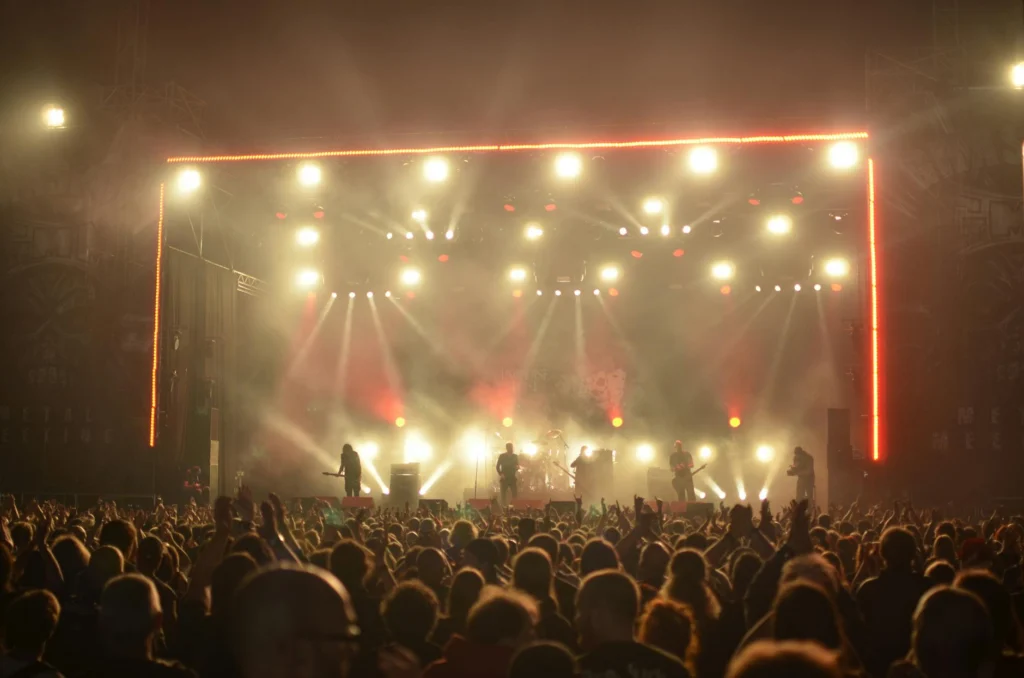 Rock concert crowd with stage lights illustrating performance based authenticity in modern pop music