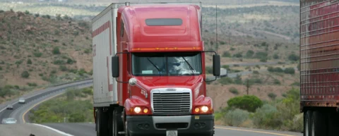 Semi truck on highway illustrating truck driver fatigue risks in modern logistics
