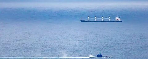 Submarine surfacing demonstrates buoyancy physics as ballast tanks expel water