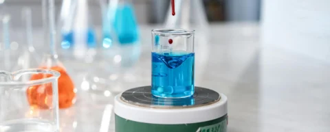 Magnet levitating above a superconductor demonstrating the Meissner effect in room-temperature superconductor research