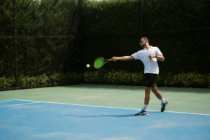 Professional tennis player mid-backhand, illustrating tennis biomechanics analysis