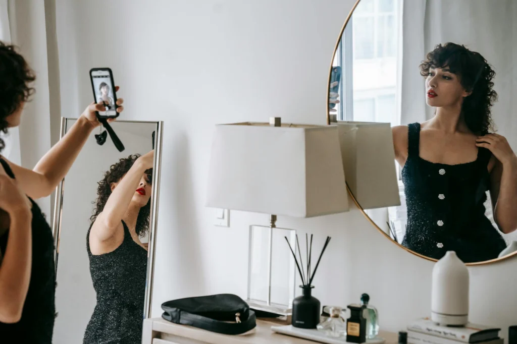 Digital image curation in action: woman studying her reflection
