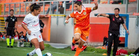 Stadium crowd at women's soccer match representing NWSL expansion growth