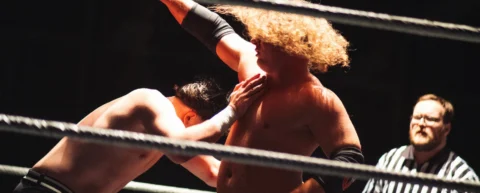 Wrestling ring under spotlight representing a wrestling career renaissance