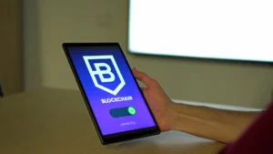 A person holds a tablet displaying a blockchain connection screen.