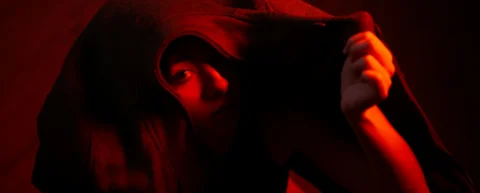 Shadowy figure at a laptop evoking modern spy recruitment conducted online
