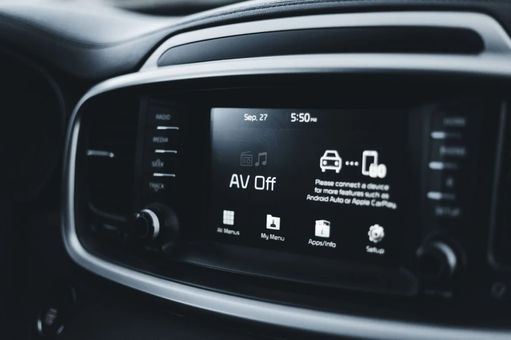 In-car connectivity screen showing software controls on a modern vehicle dashboard.